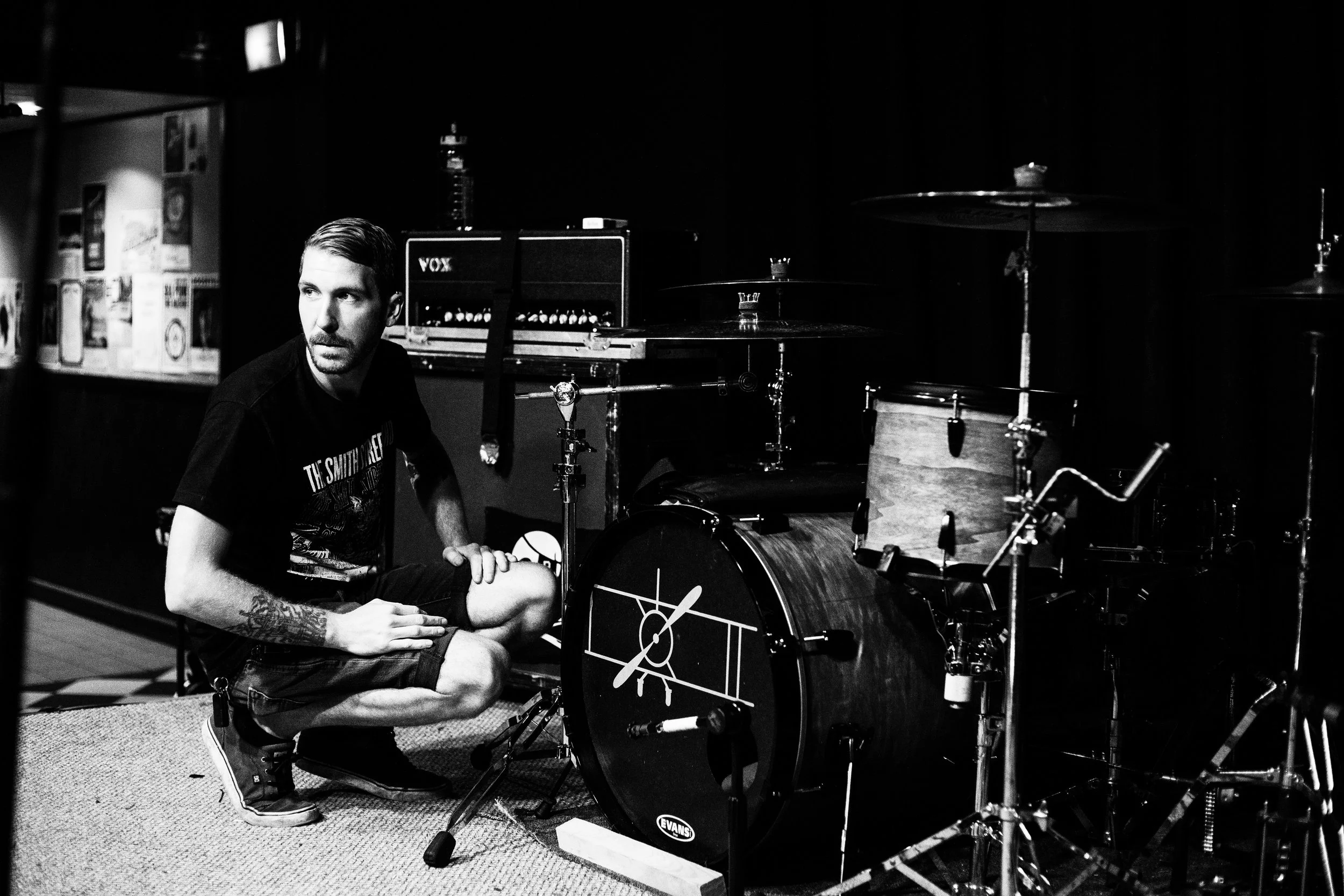 Steve Gibson finishes setting up his drums before soundcheck in Boston, Massachusetts.
