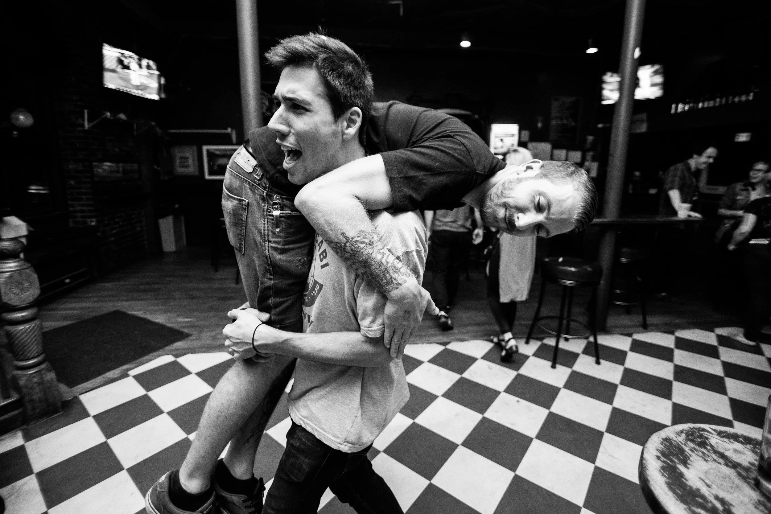 Max Stern carries Steve to the door of Great Scott after the show in Boston, Massachusetts.