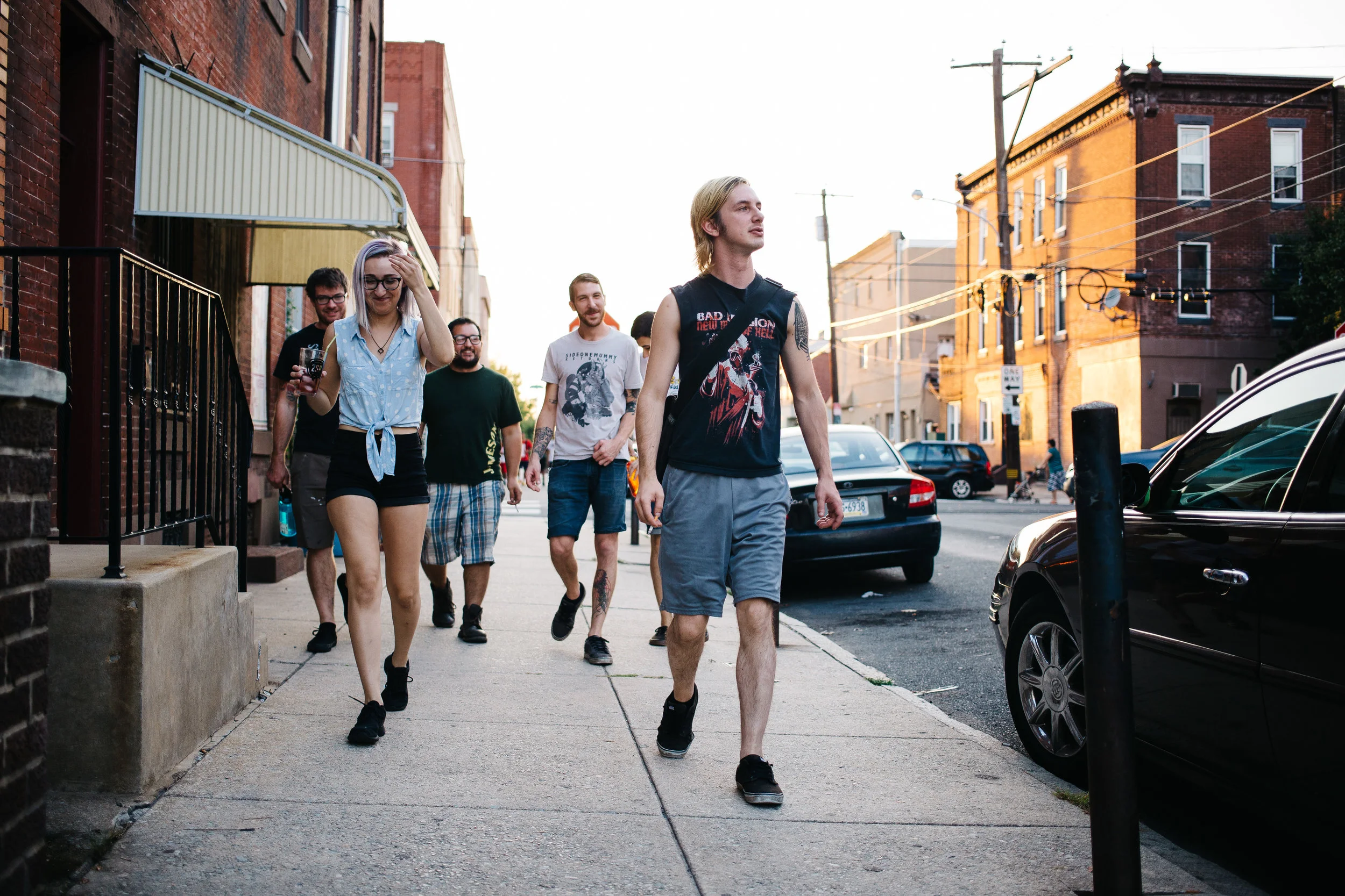 The gang walks to the van to head to the show.