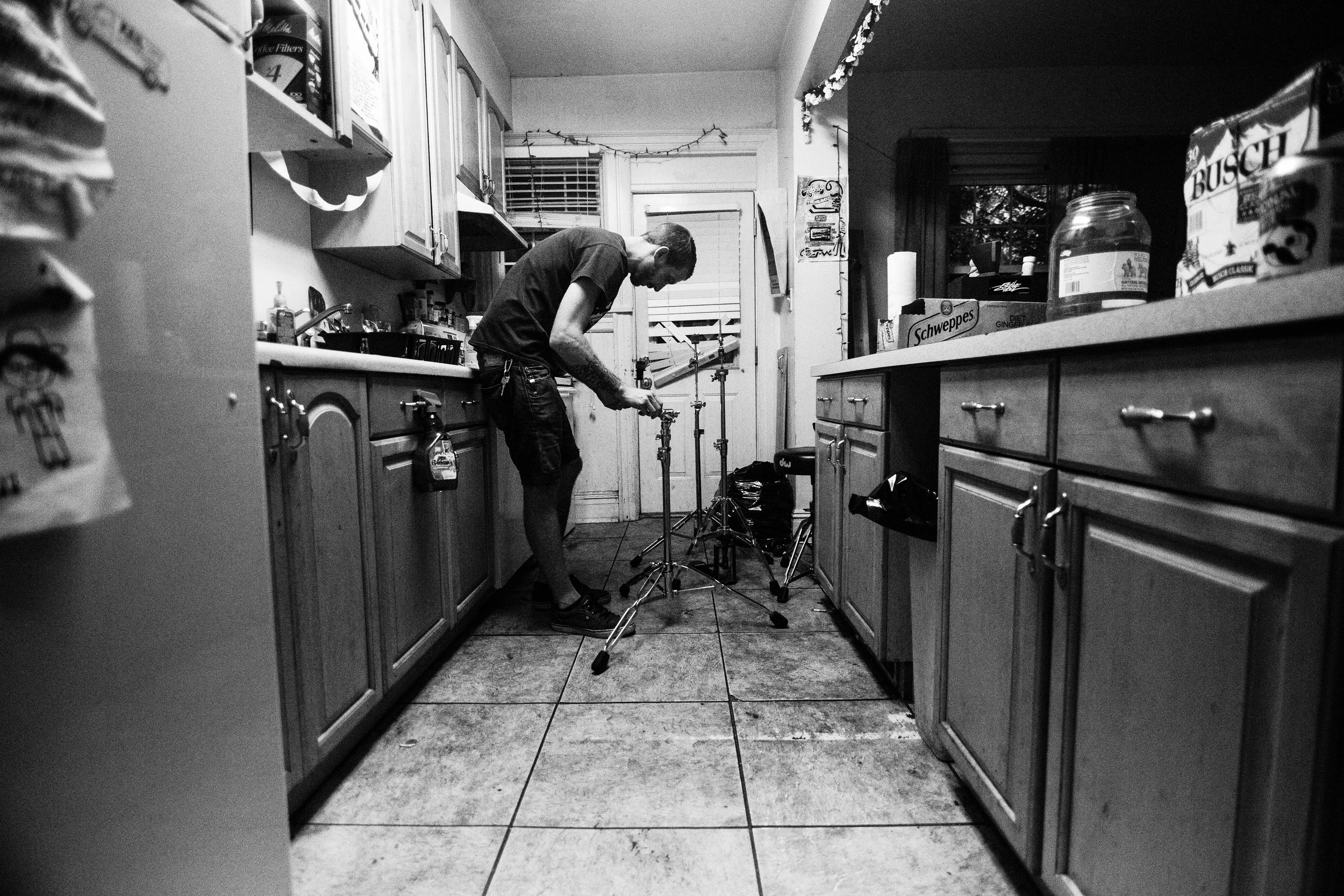 Steve sets his drum hardware up. 