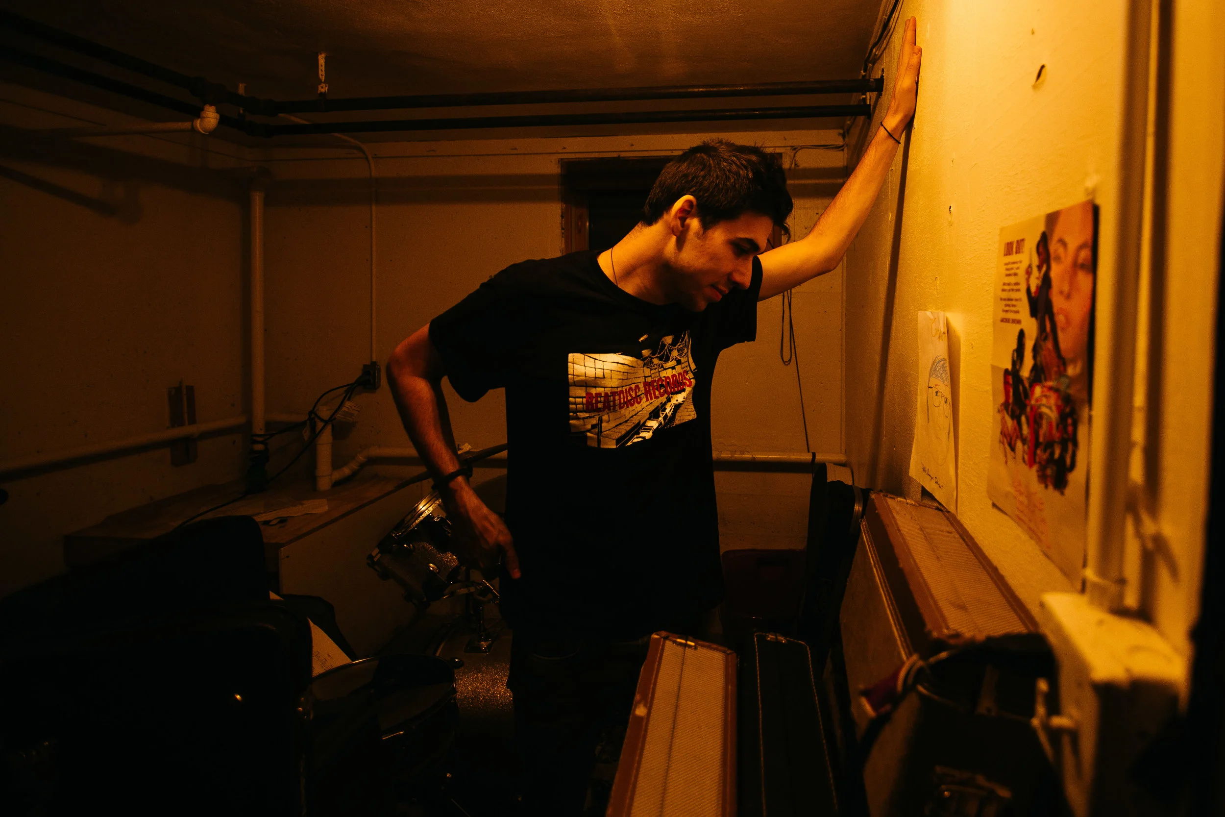 Max in the back room of the basement Signals Midwest were playing in Madison, Wisconsin. 