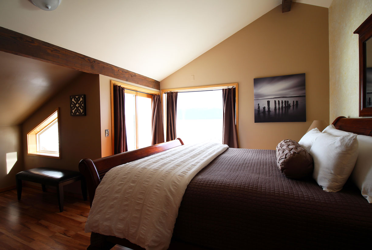 Master bedroom upstairs with private deck