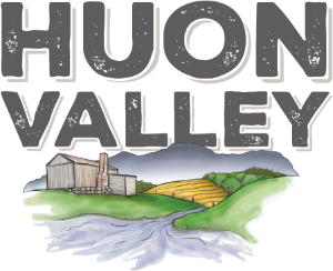 Color illustration of a landscape with water, green hills, a blue mountain, and a wooden fence, with the text 'HUNN VALLEY' in the background.