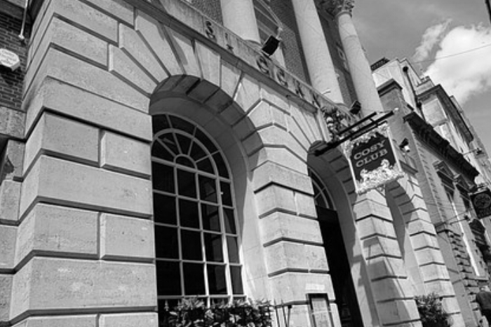 The Cosy Club in Bristol Our Bristol cupcake workshops take place at the cool and trendy Cosy Club on Corn Street. Conveniently situated in the heart of Bristol’s historic city centre, the Cosy Club is located in a majestic former banking hall with marble flooring and an awe inspiring domed roof this building simply oozes grandeur. Our cupcake events at the Cosy Club are either held on a private mezzanine area on the restaurant or for smaller groups in the private Peacock Room. Want to know more, click here.