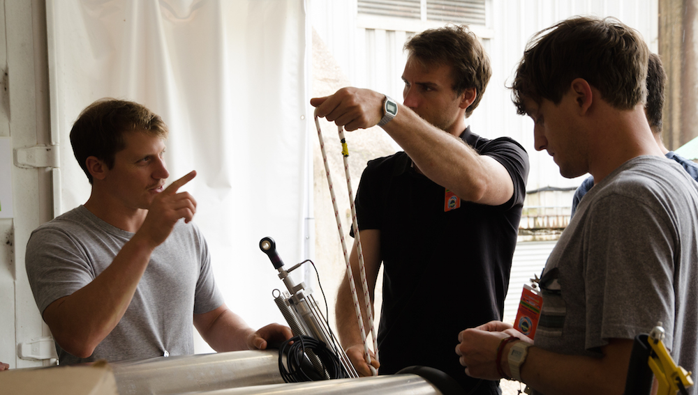 Lehmann (center) and his team making final adjustments to their 1/20 scale prototype.