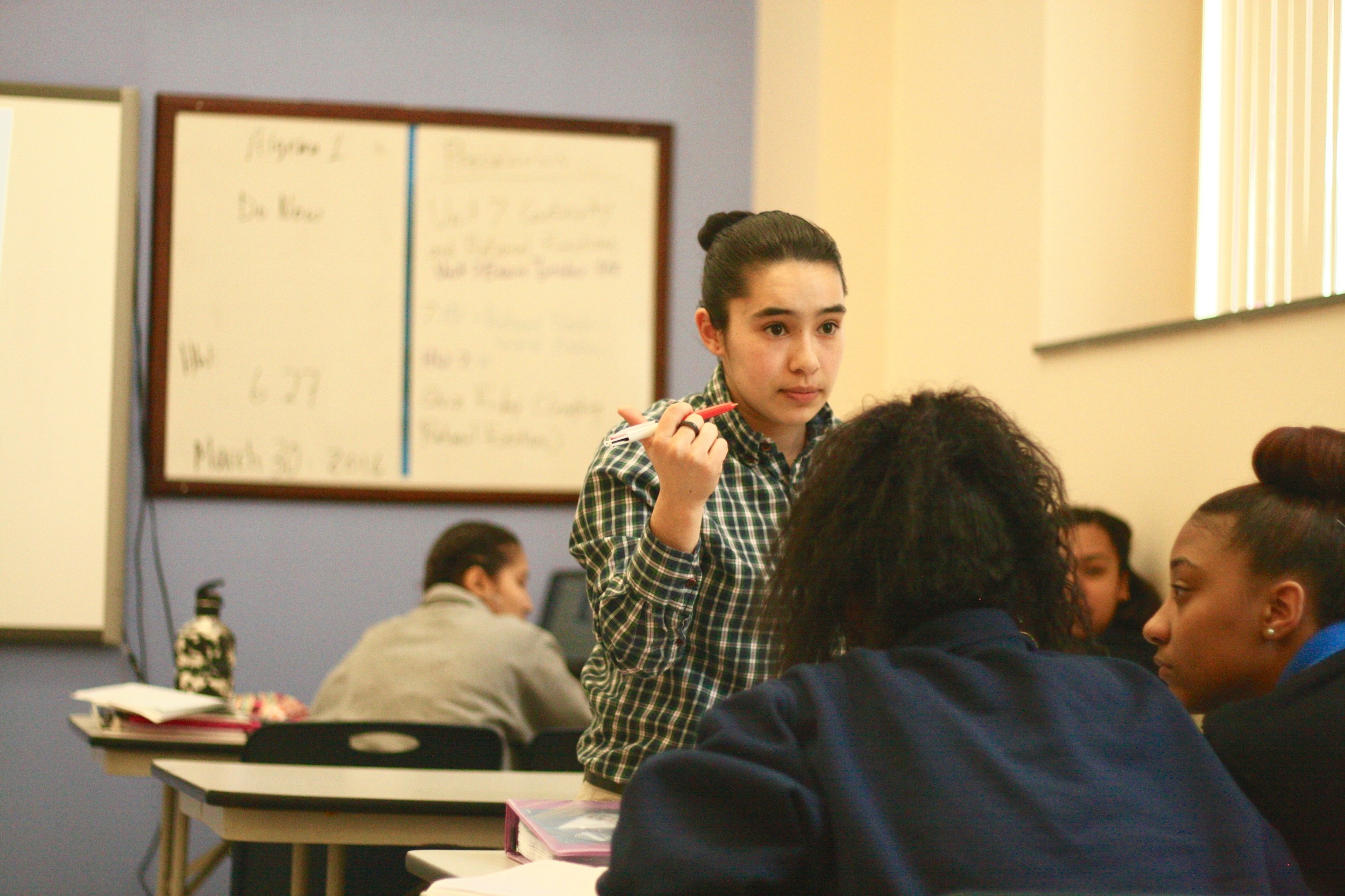 Miranda-Gomez directs students in her class.
