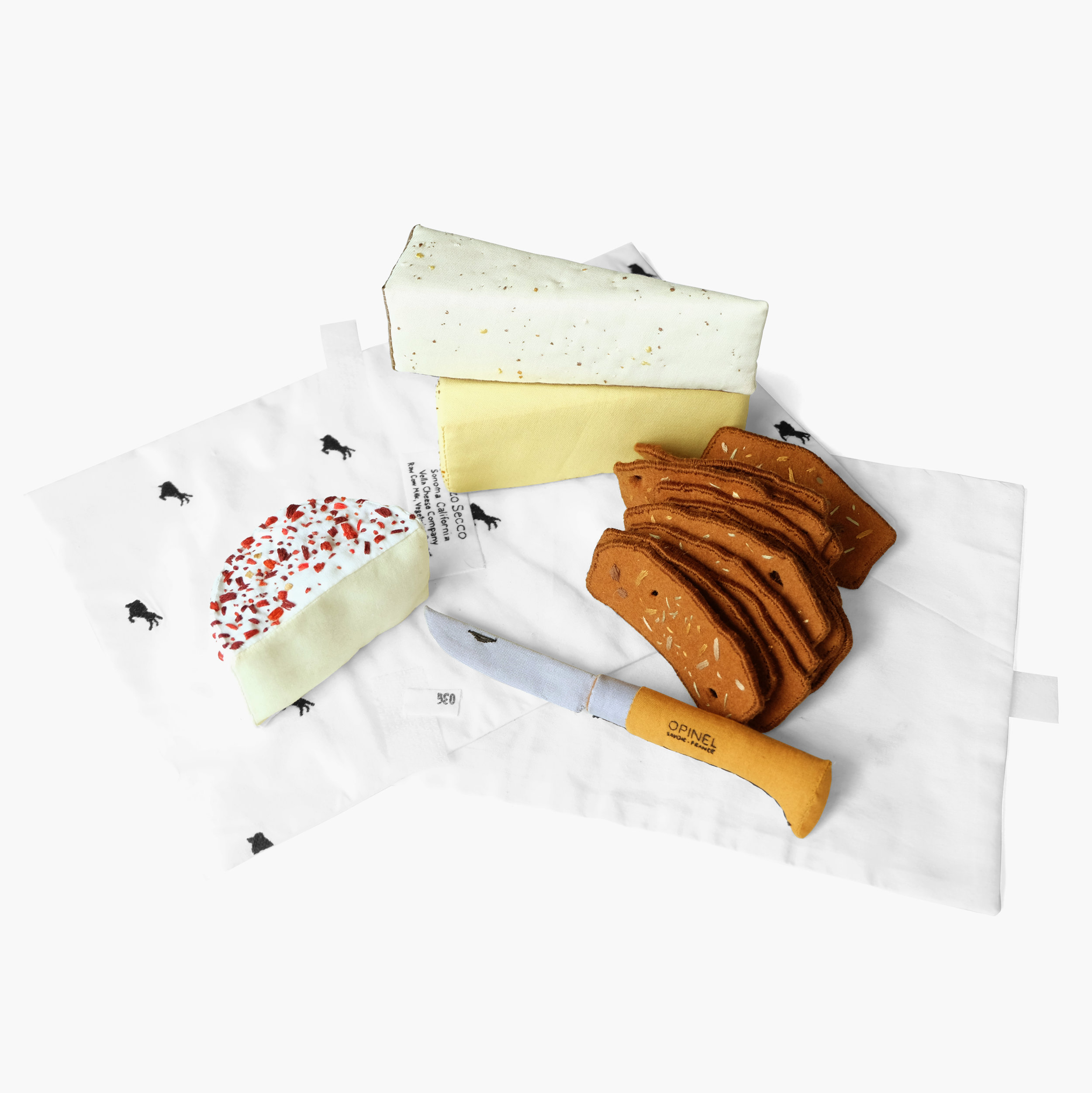 Triple Cream Dream Cheeses, crostini, and Opinel knife from Cowgirl Creamery Foam, fiberfill, felt, cotton cloth, embroidery floss Approximately 4.5 x 15 x 11 in 2015