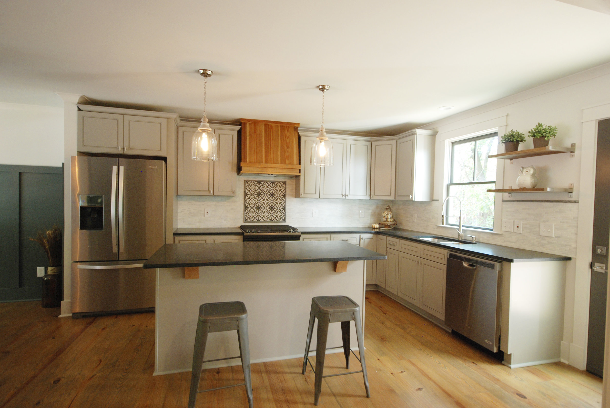  Reclaimed factory wide plank floors and custom range hood 