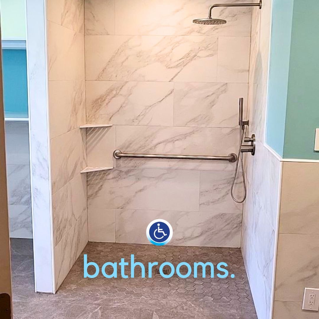 A thoughtfully designed accessible bathroom in Whitmore Lake, Michigan, featuring a custom roll-in shower, open floor space, and safety features created to help a homeowner living with Multiple Sclerosis remain independent at home.