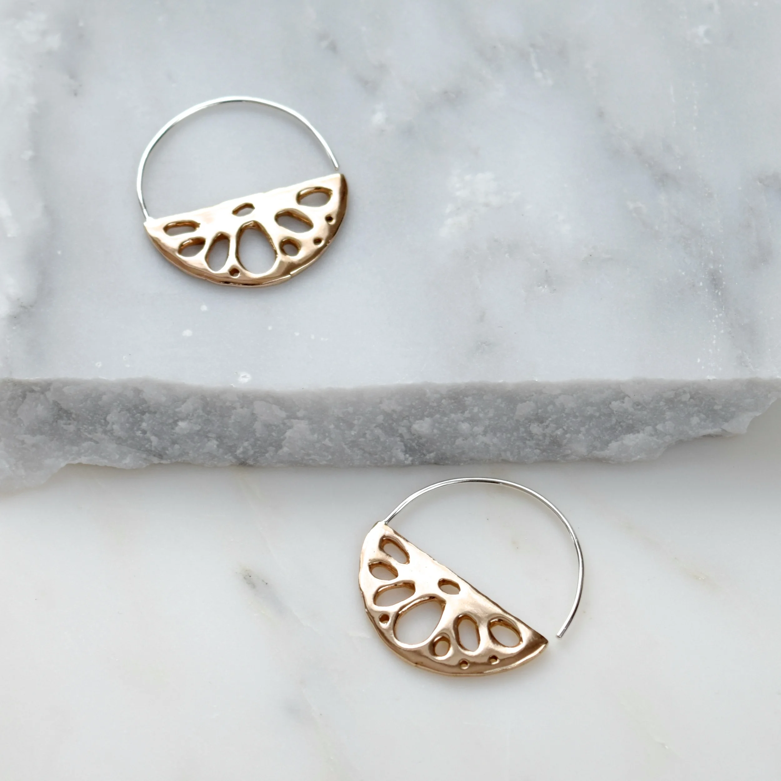 Lightweight lotus earrings inspired by a slice of lotus root, a symbol of perseverance. Wear them as a reminder that where there's a will, there’s a way.