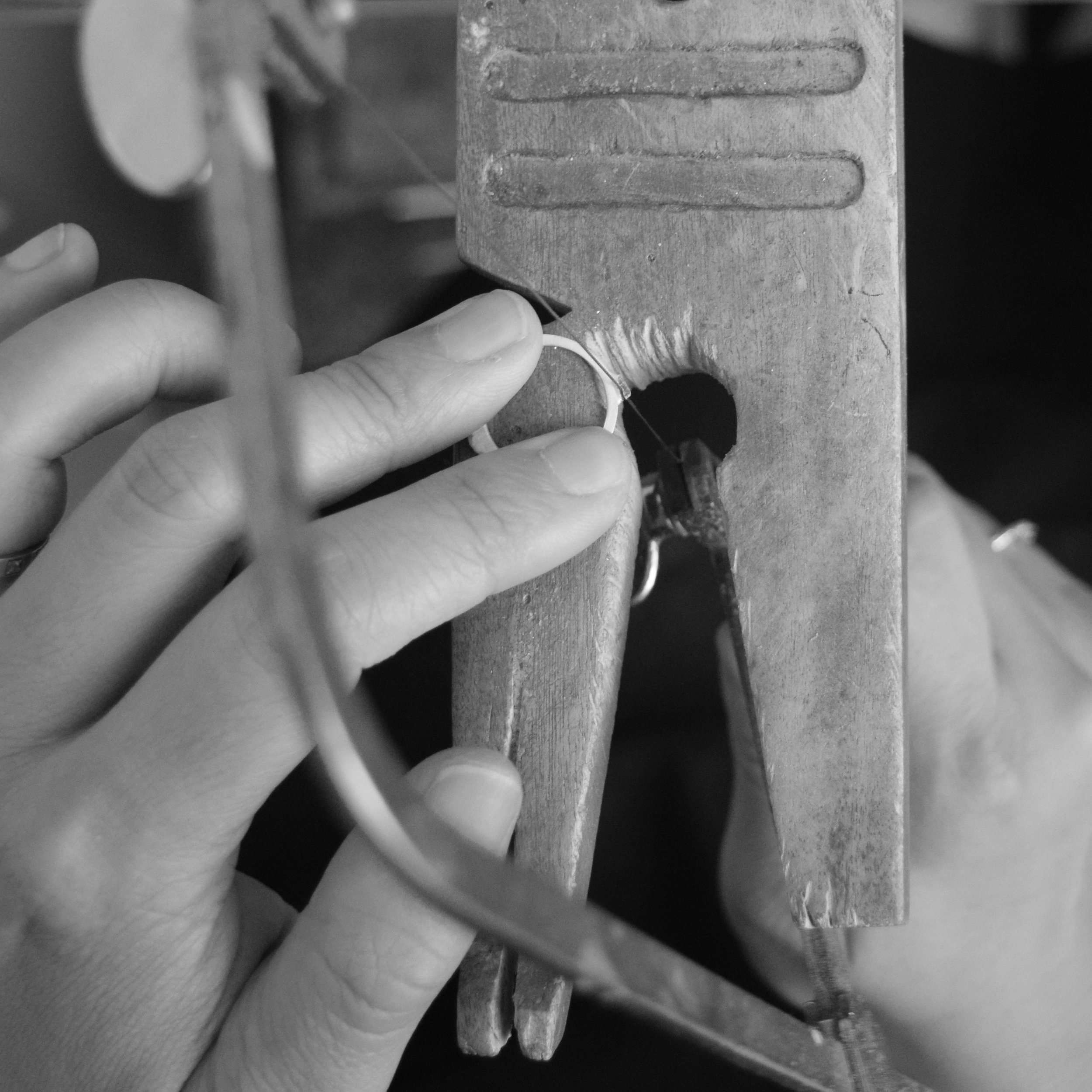 1.We saw off the "sprue" on the casting, which is excess metal that held the ring in place during the casting process.