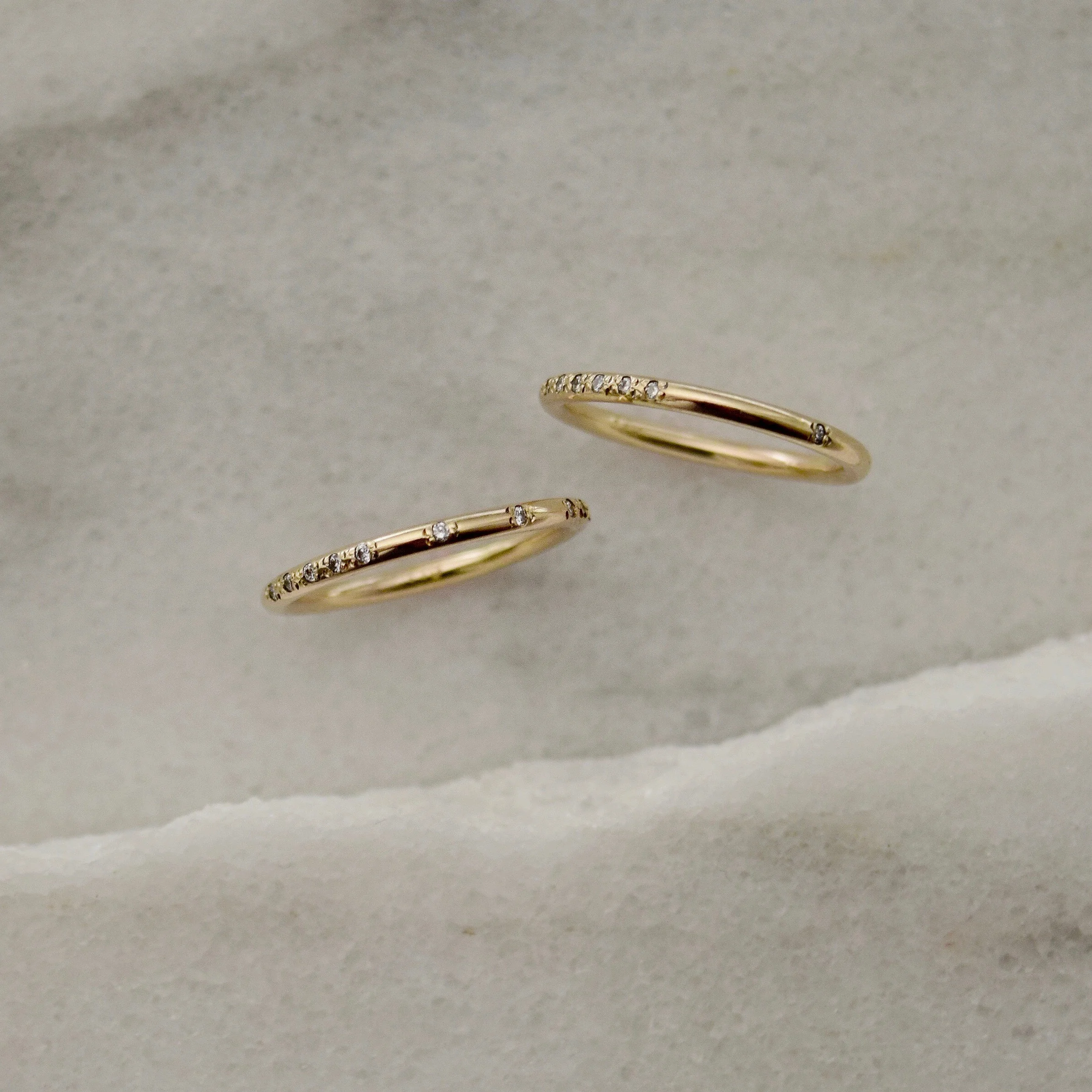 A subtle Morse Code ring disguised as a gold diamond band. The sparkling diamonds and spaces in between together spell out whatever it is that stirs your heart. What will yours say?