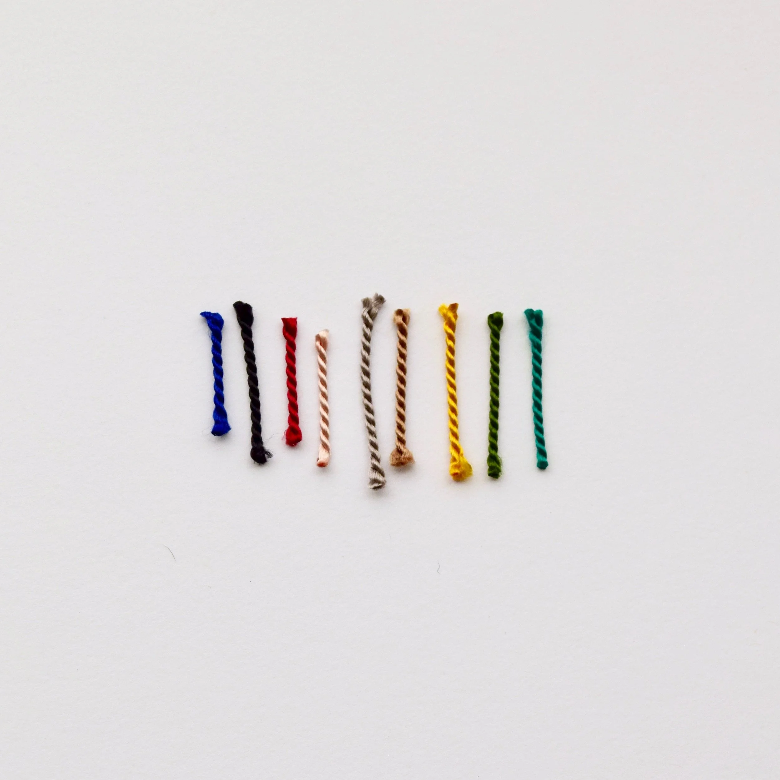 A mountain bracelet in colorful silks! A hand-carved mountain is finished with adjustable, pure silk cords in your choice of earthy or bright colors. A fun reminder to enjoy the journey.
