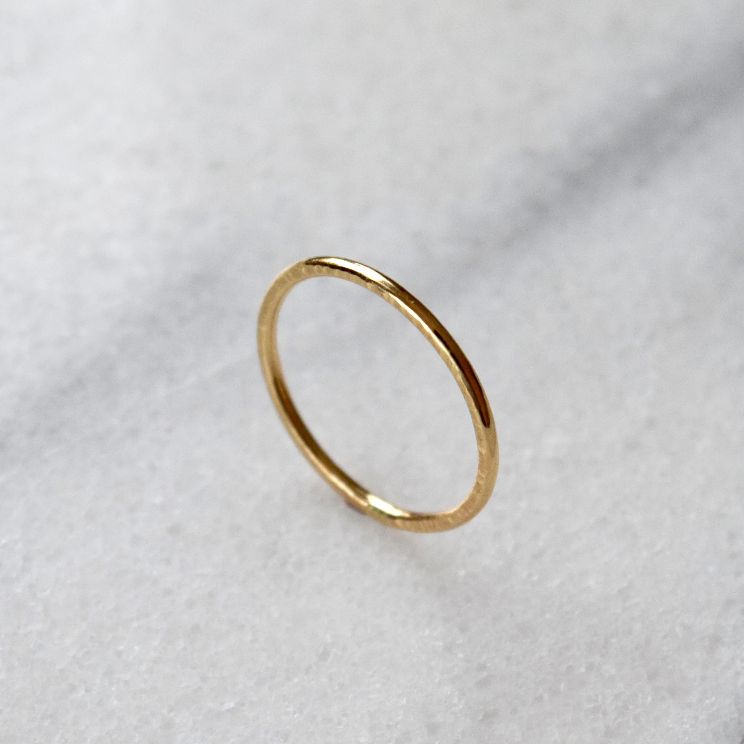 A deceptively simple solid gold band, with a smooth front and textured side. Inspired by the concept of imperfect beauty. View more rings at www.everlijewelry.com/essentials
