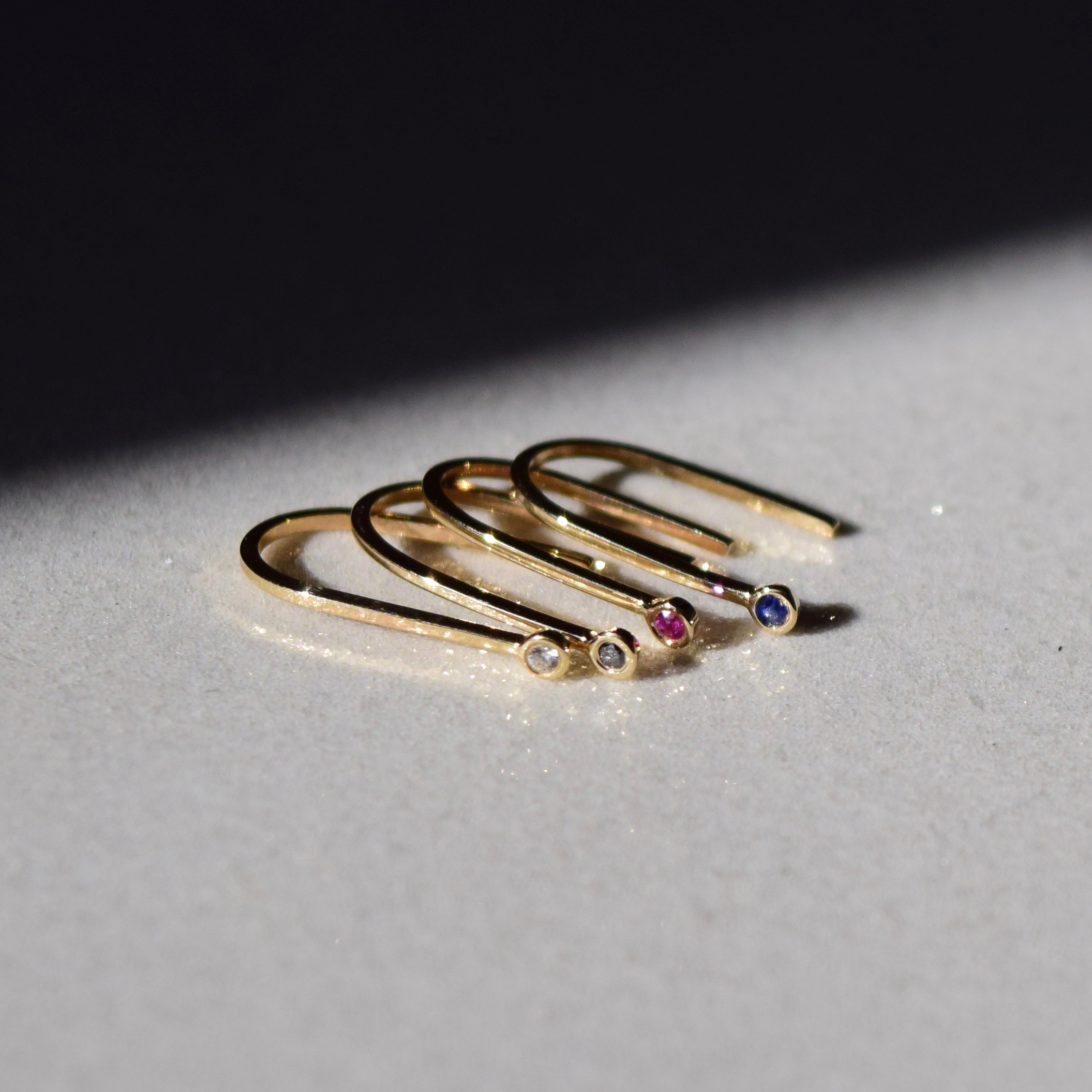 Simple gold ruby earrings, shaped like little magnets. A reminder to be the energy that we want to attract.