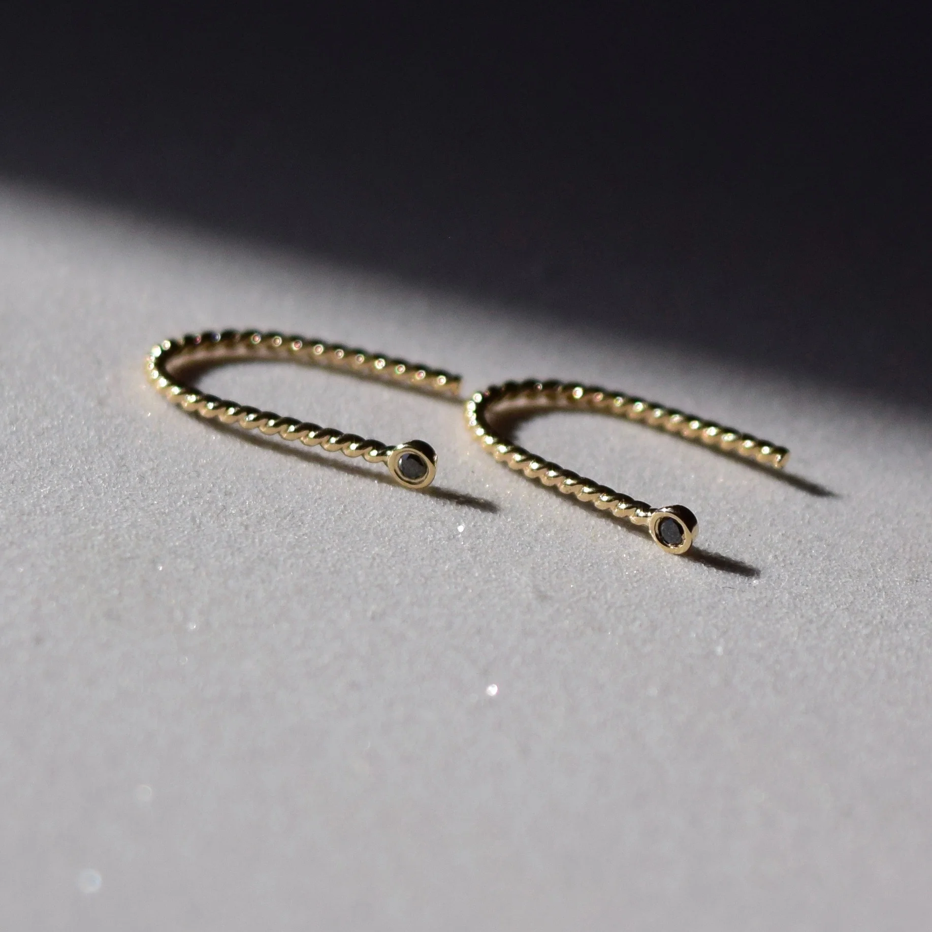 Simple black diamond earrings shaped like little magnets. A reminder to be the energy that we want to attract.
