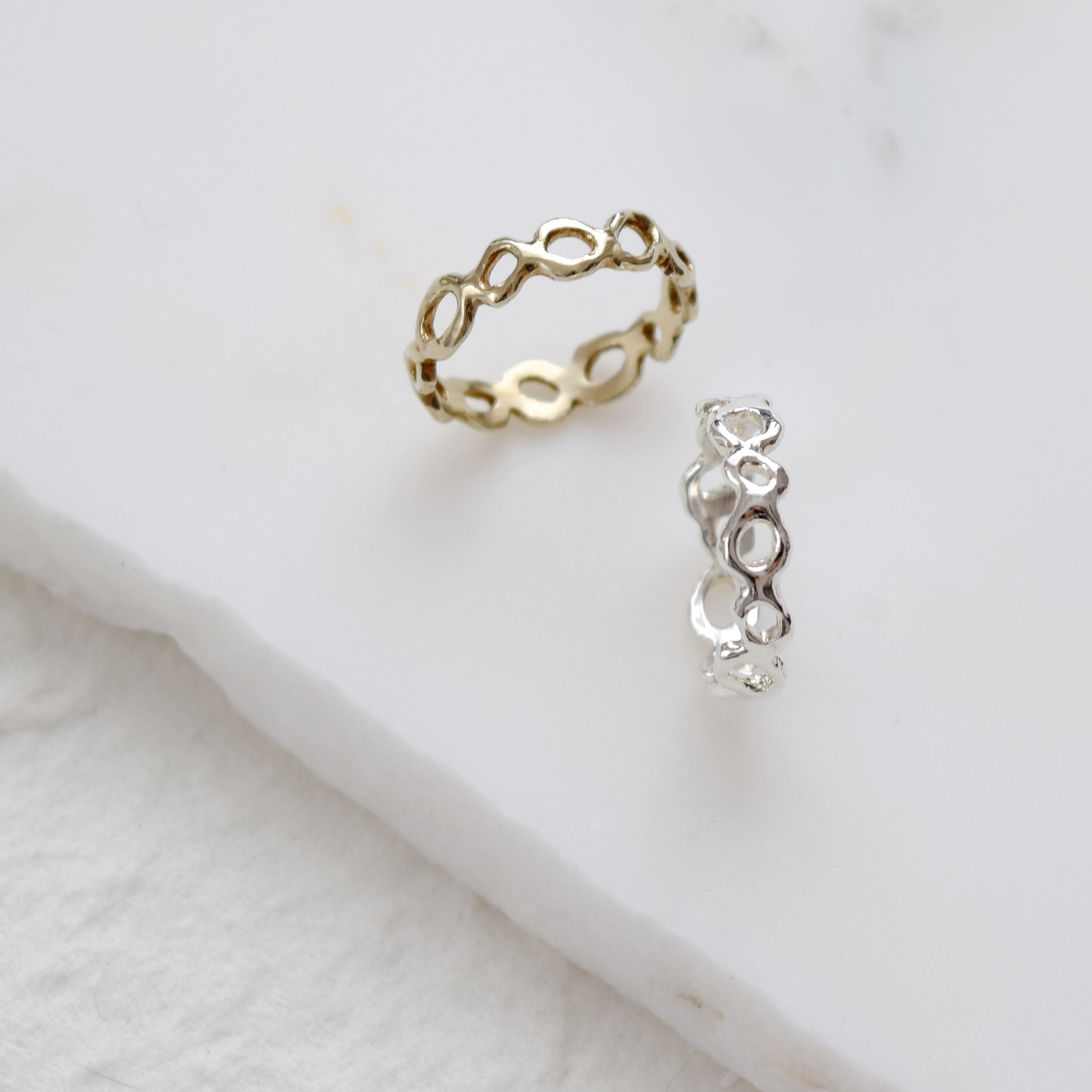 A lotus root inspired eternity style ring, with organic cutouts in a playful arrangements. Wear it as a reminder to stay deeply rooted in what matters to you.
