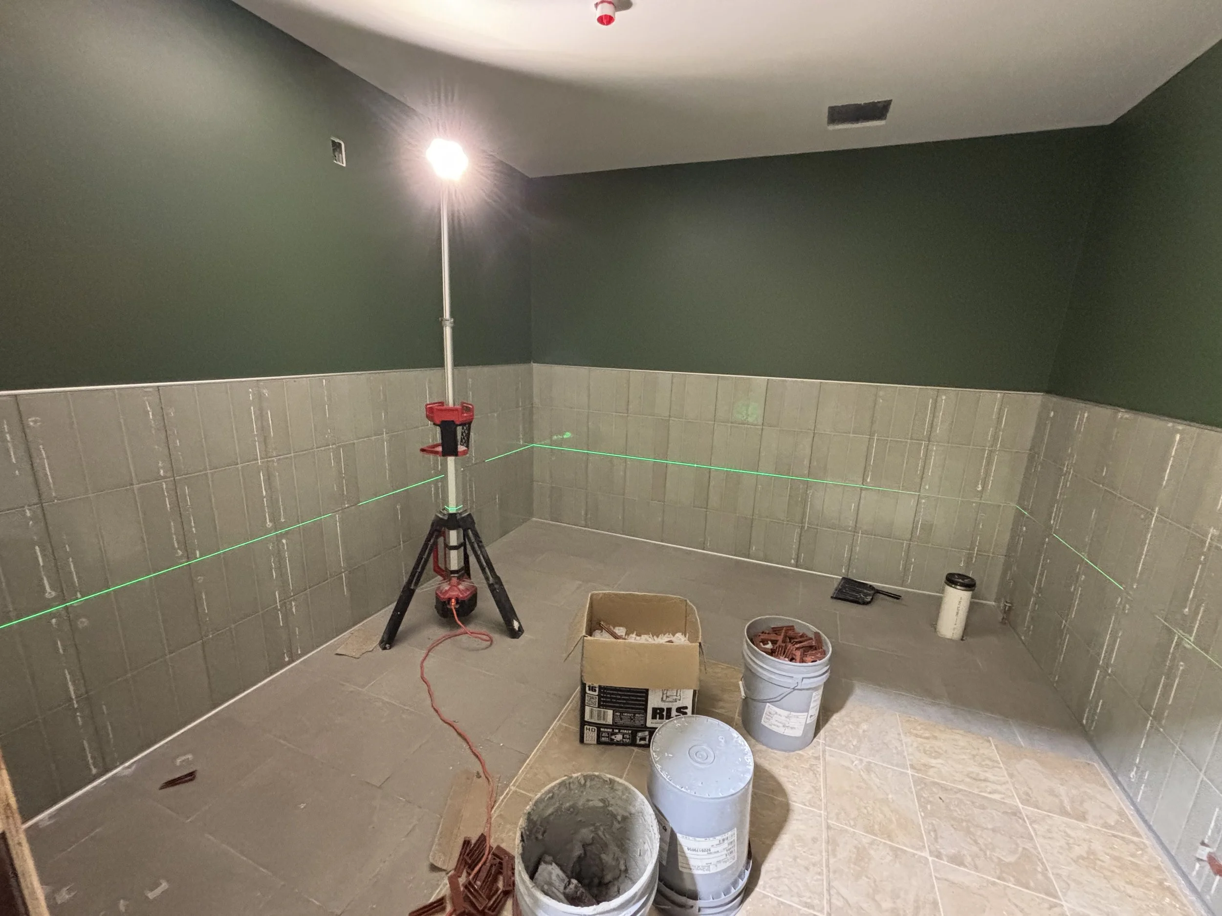 July 11, 2025 - Bathroom tile going in!
