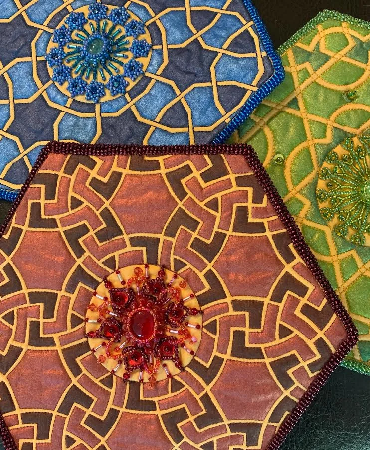 Jamie Kouba - I am a maker. A craftsperson. And, occasionally, an artist. I am happiest when my right brain is engaged in the creation of beauty: where line and design meet color and light. Much of my original work comes from a textile challenge group of like-minded women. We met to collaborate, inspire, teach, and support each other on our unique, yet connected, textile journeys. I find inspiration in EVERYTHING, as you will discover working your way from piece to piece. My latest inspiration comes from my son, Jake Kouba, as we explore the infinite possibilities of Islamic Tile design. We’ve only dipped our toes into the water….there is more to come. Enjoy!