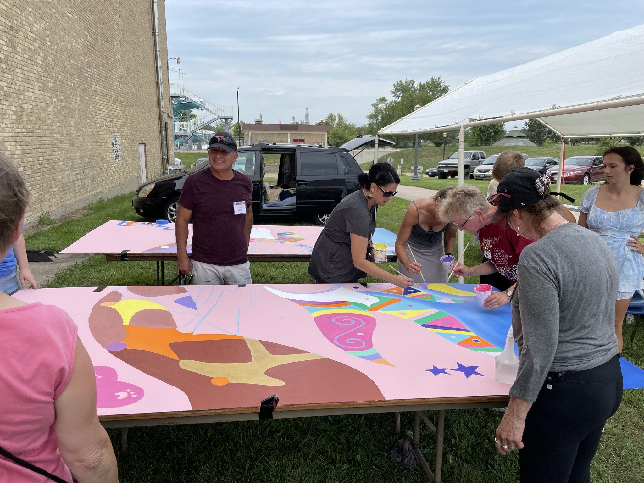  Yepez and festival visitors painting mural 