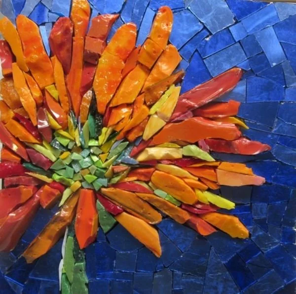 Mosaic glass orange flower on blue background