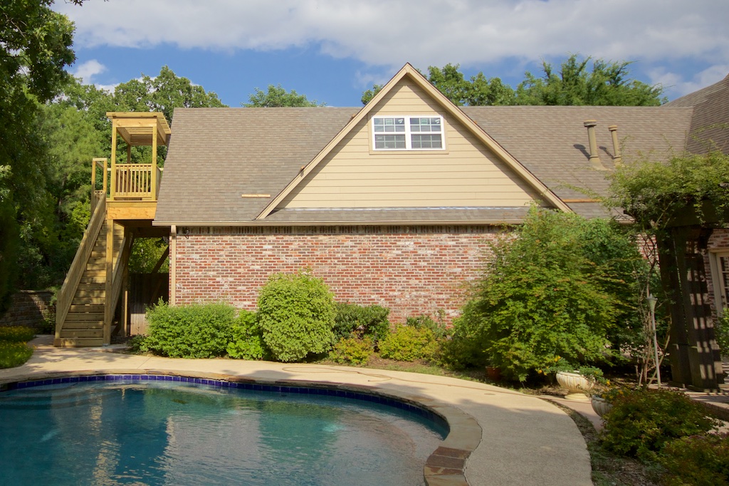 This deck is much larger than I had originally envisioned—think balcony—but it kind of took on a life of its own under the influence of our architect. I don't care for the way it extends beyond the roofline, aesthetically speaking, but it's a lovely deck. 