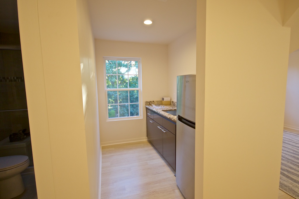  Now heading toward the studio, kitchenette is on the right.&nbsp;Not sure why the walls look yellow in the pic; they are white.&nbsp;Still some decor finishing to do in the kitchen, but no hurry. 