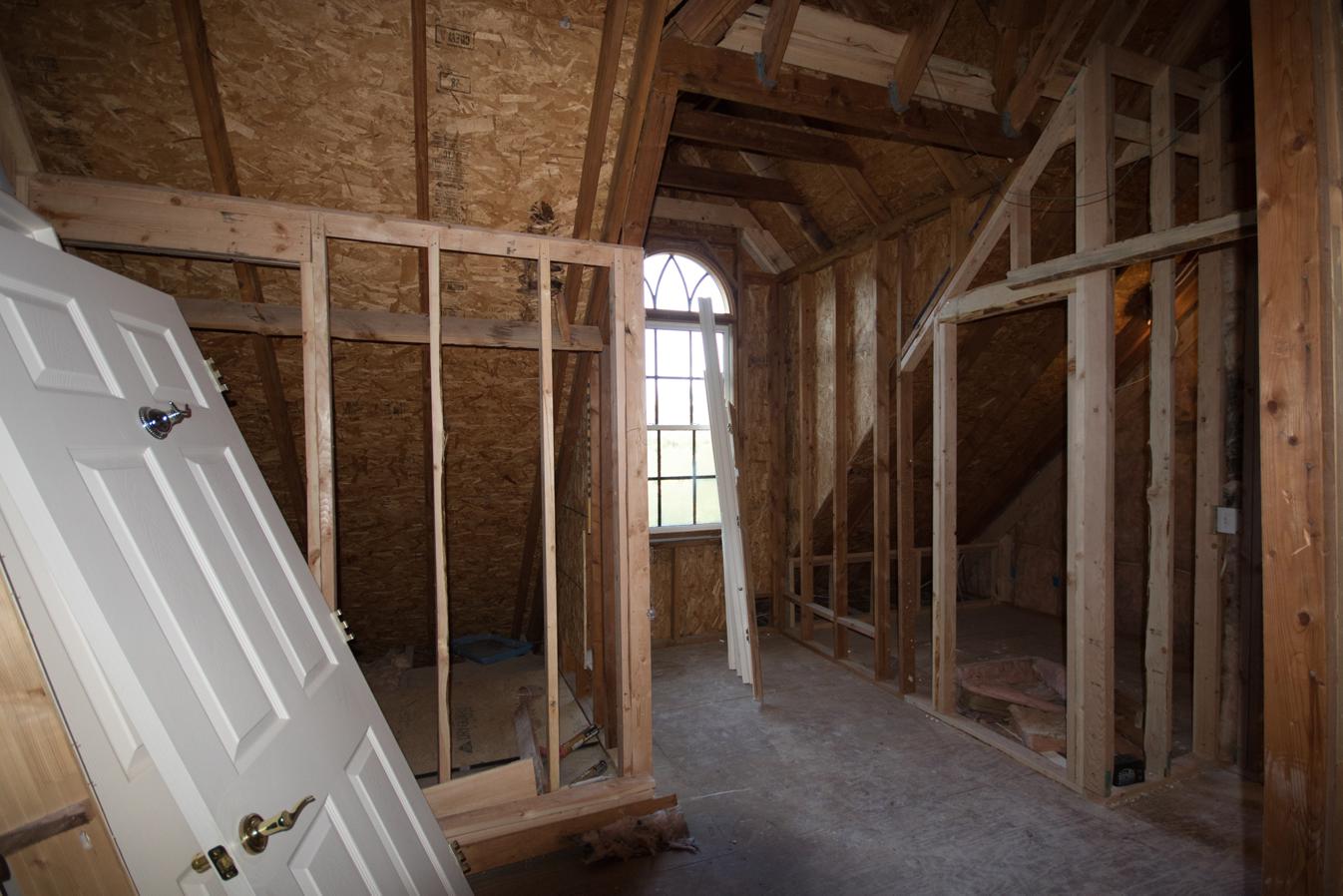  Just after construction began: Two closets on either side of the dormer window are taking shape. The attic door to the hall is off to the extreme right. 