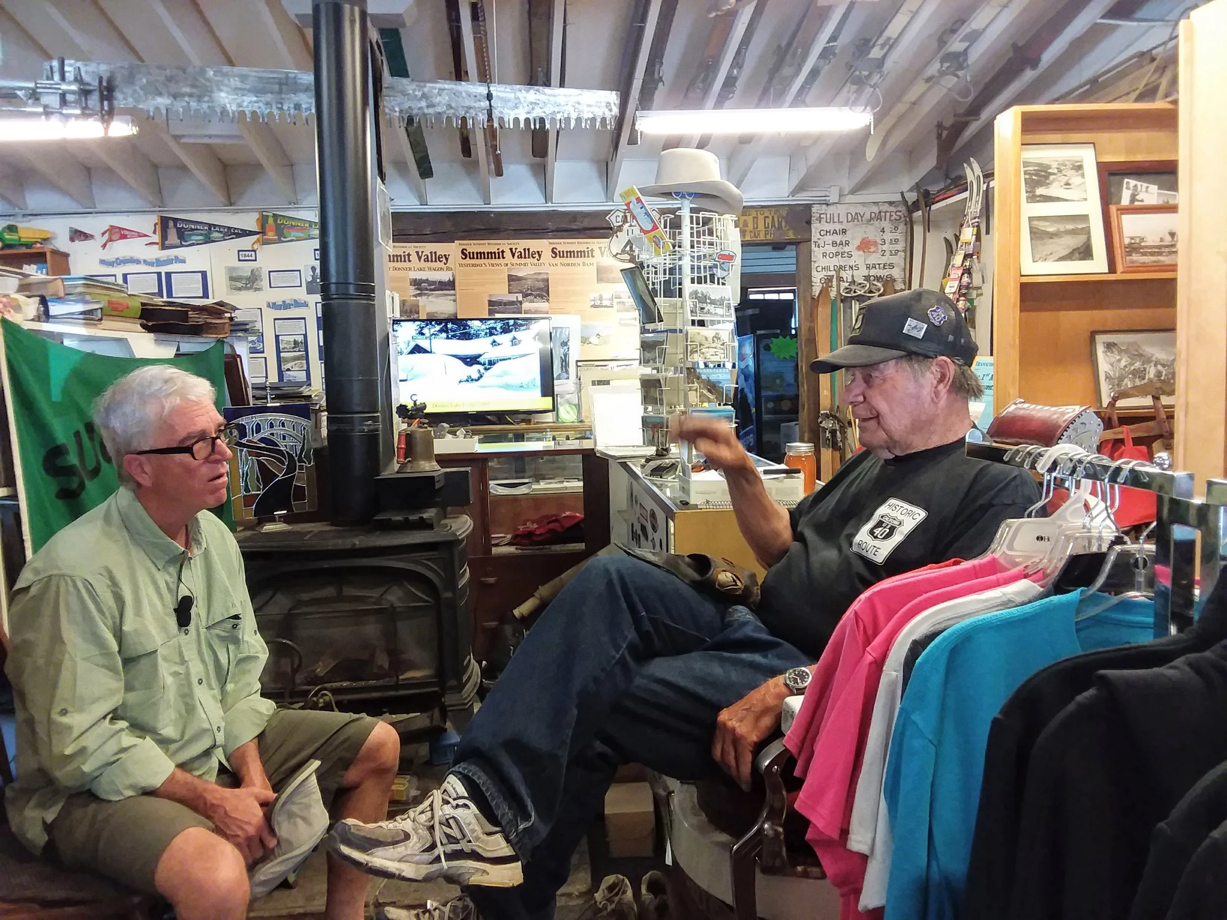 Trey talking to Norm who sit’s in his “barber chair” at the museum.,
