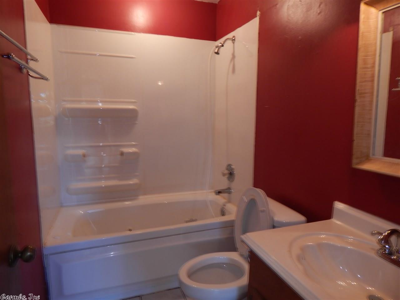 flipping_business_flip_house_before_picture_southern_arkansas_red_bathroom.jpeg
