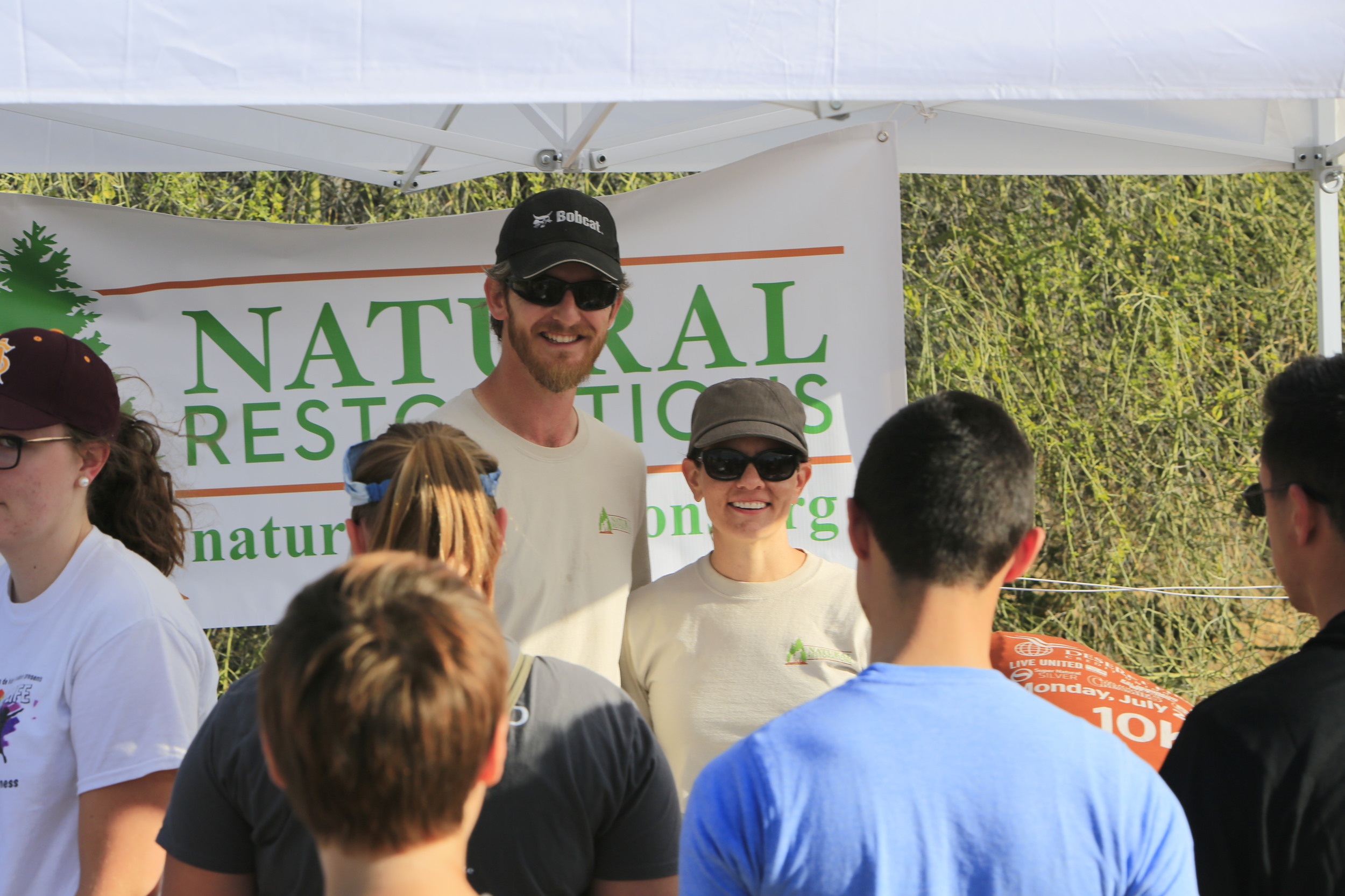 Justin & Nicole greeting volunteers