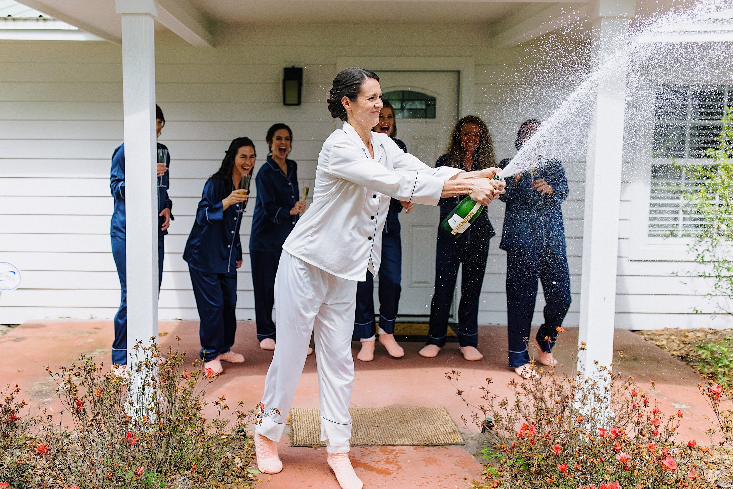004-Bride-spraying-champagne-on-wedding-day.jpg