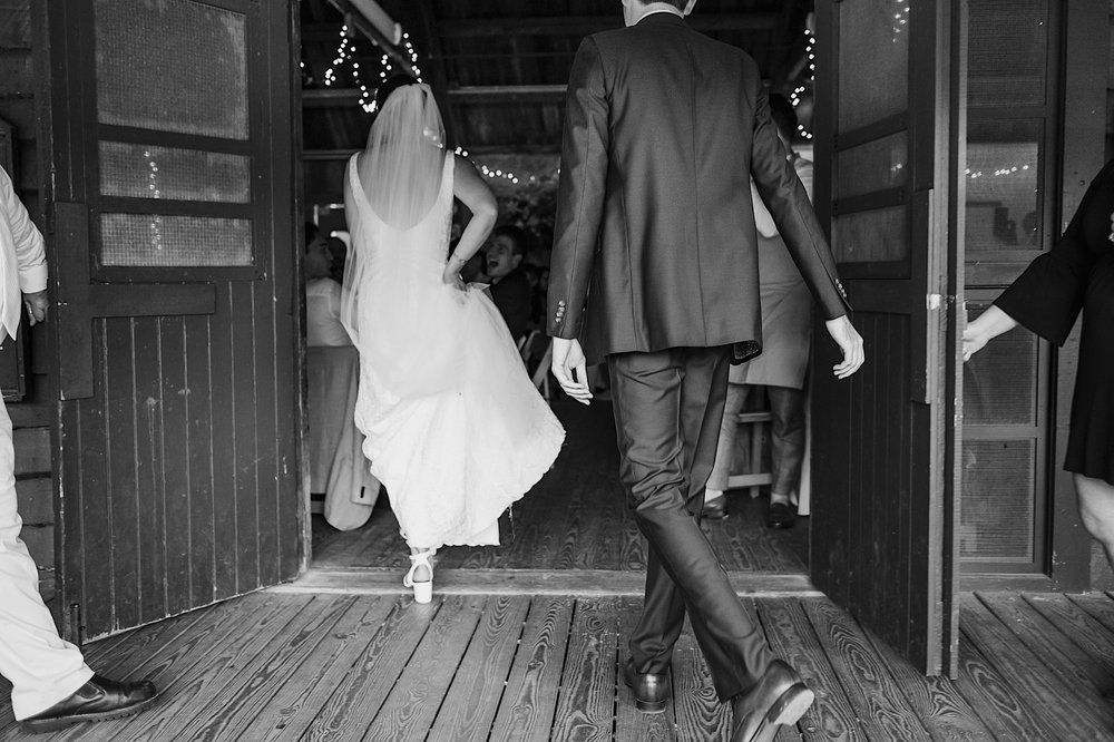 037-ZacWolfPhotography-20220611-Blog_Bride-and-Groom-entering-Orlando-Wedding-Reception.jpg