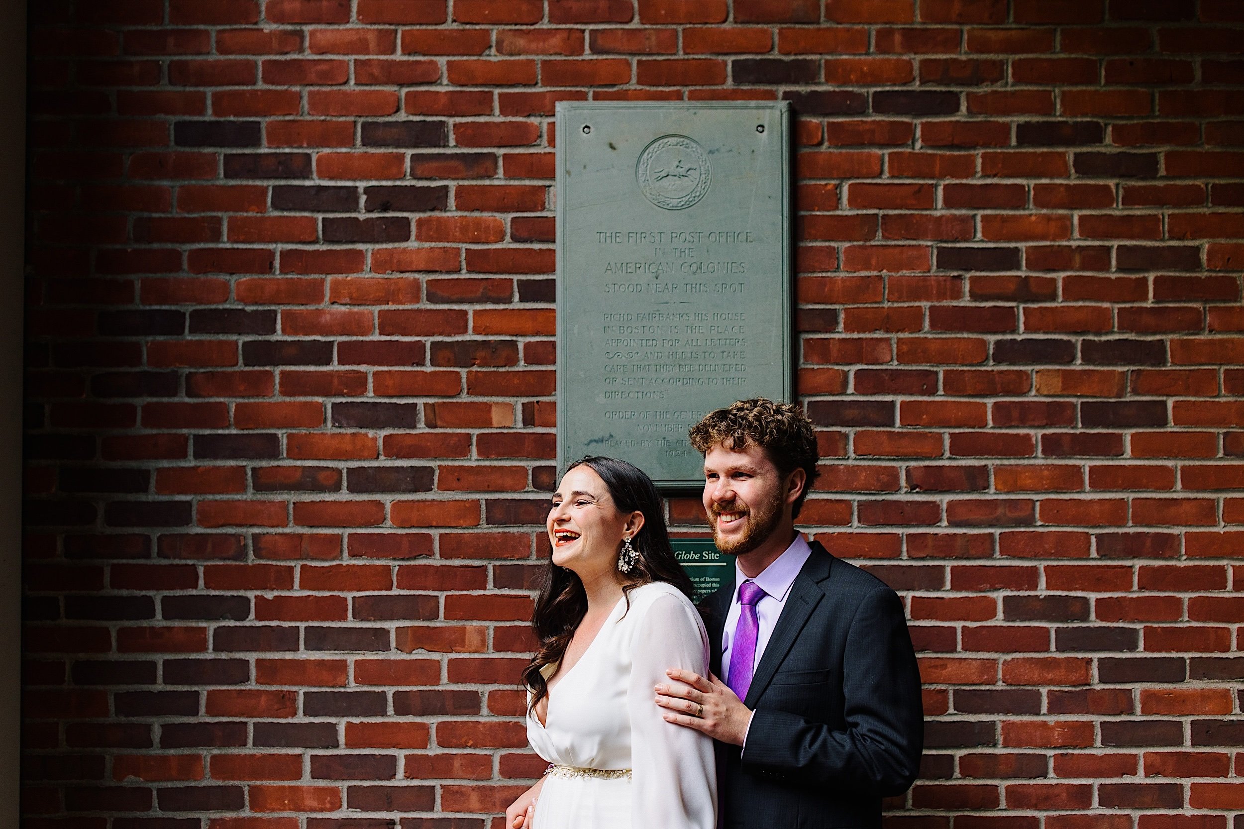 068-ZacWolfPhotography-20220904-Blog_Bride-and-Groom-in-front-of-brick-wall.jpg
