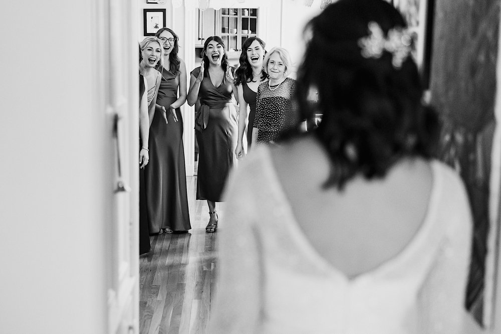 095-ZacWolfPhotography-20221015-Blog_Bridesmaids-reaction-to-bride-in-wedding-dress.jpg