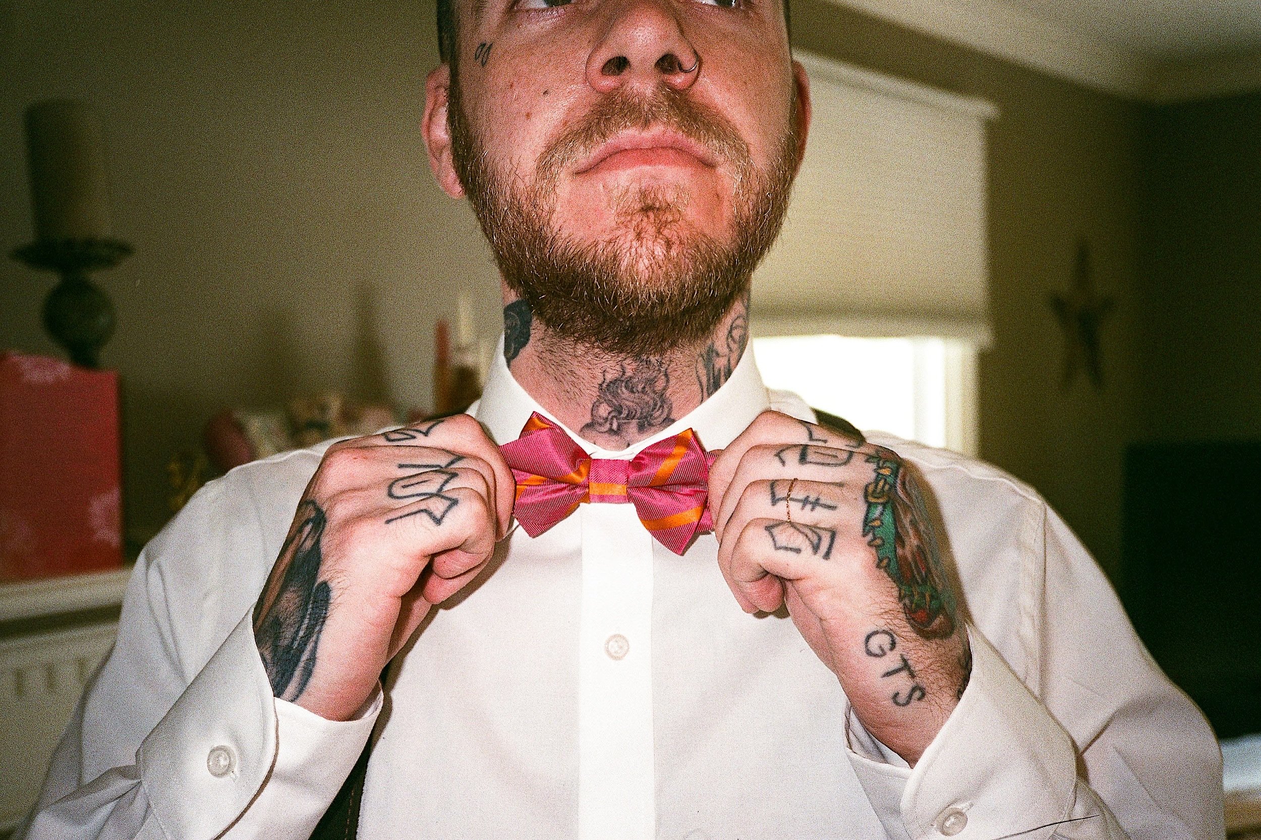 Scan33_Heavily tattooed groom getting ready for wedding.jpg