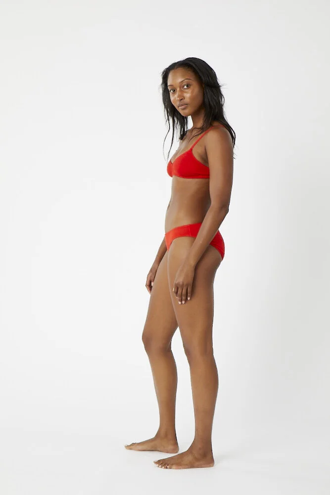 Side view of low-rise organic cotton underwear in Red.