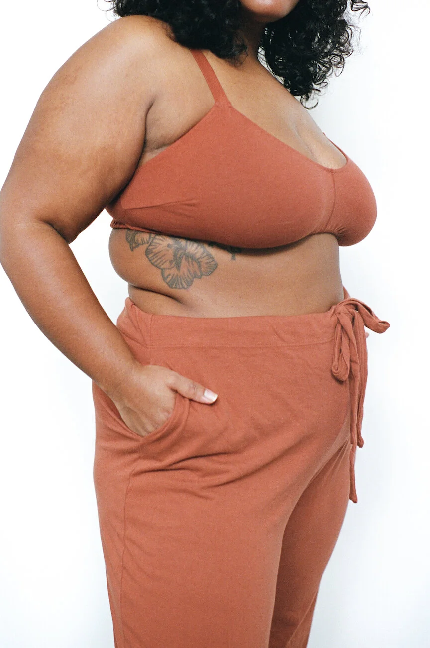 3/4 profile view of Pansy Drawstring Pants in Rust.