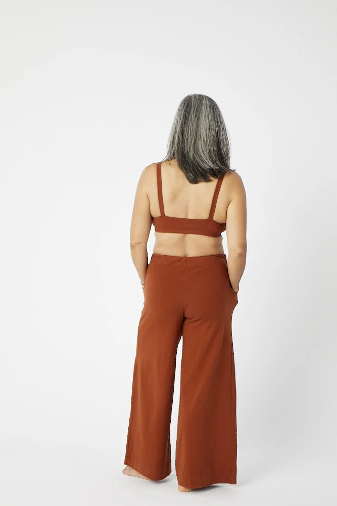 Side view of Pansy drawstring pants in Rust.