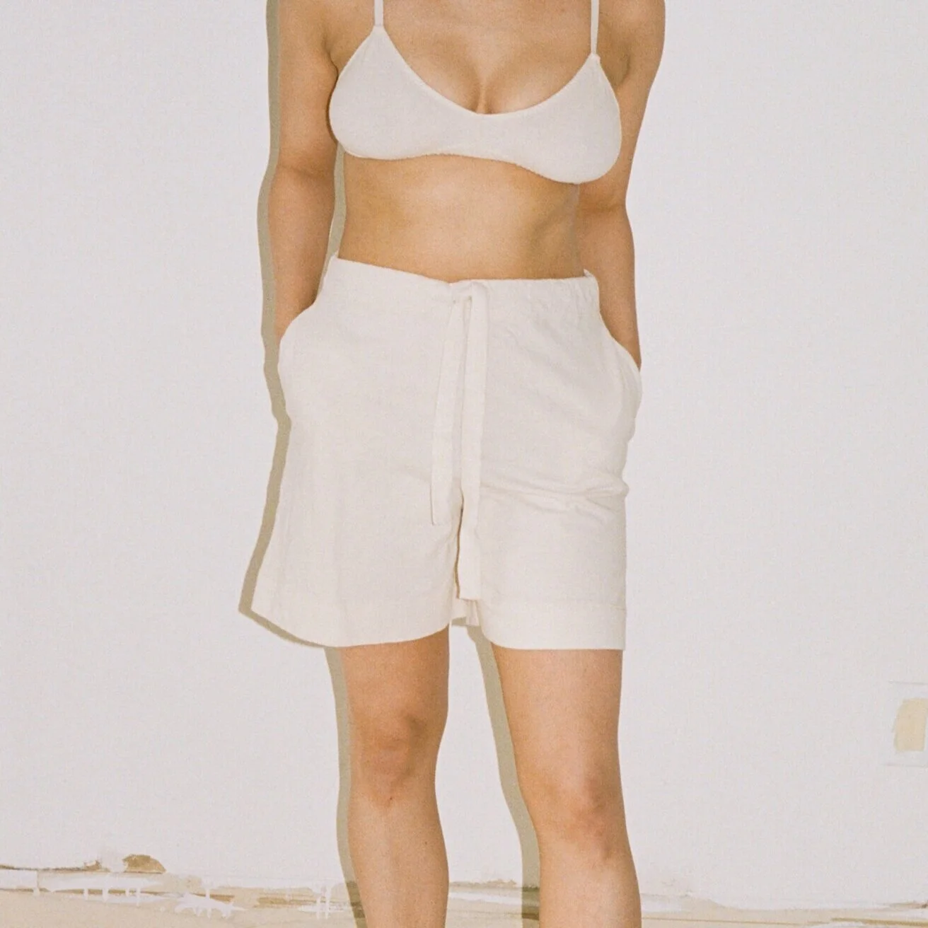 Close up of Pansy Gym Shorts in natural undyed organic cotton.