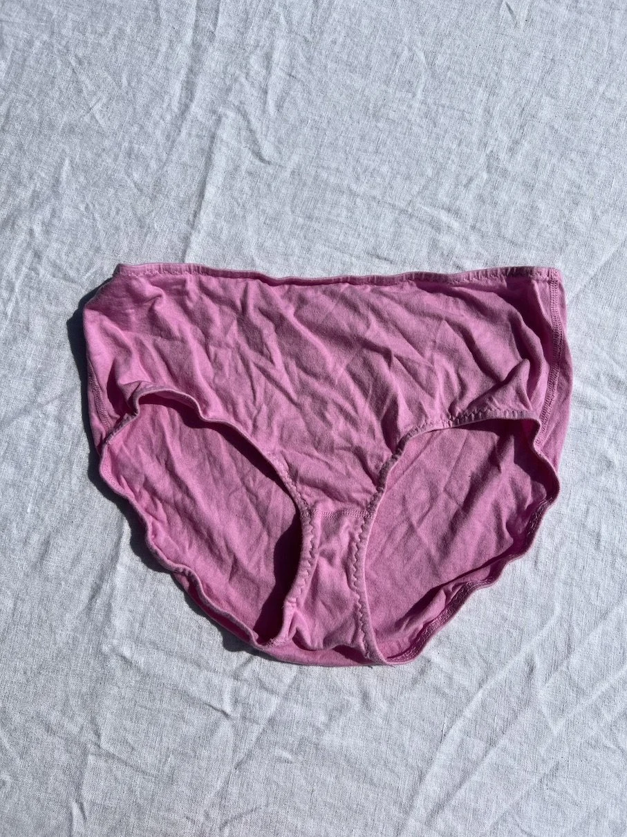 A pair of Pansy organic cotton high-rise underwear in sherbet pink.