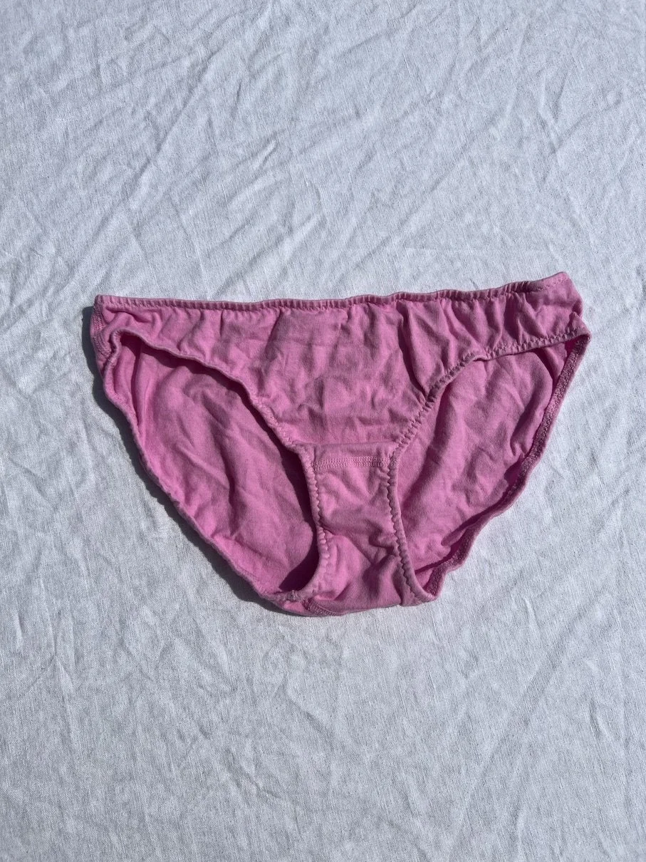 A flat photo of Pansy organic cotton low-rise underwear in sherbet pink.