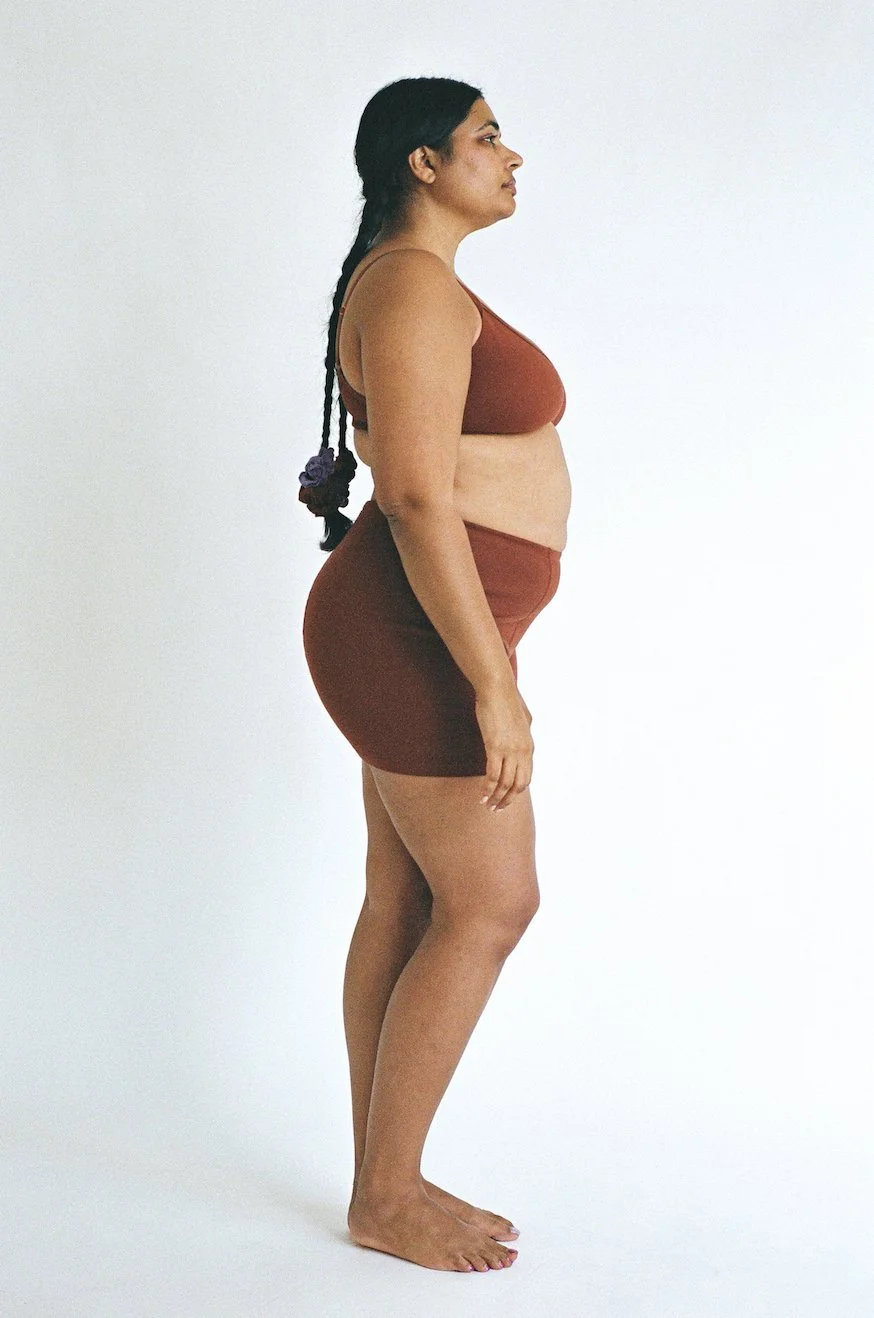 Side view of Pansy Stretch Shorts in the color Wine.