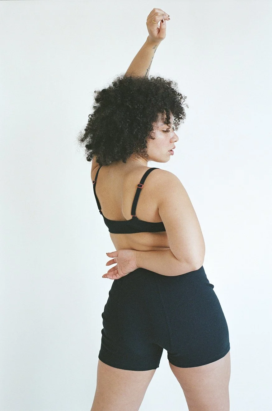 Rear 3/4 view of Pansy Stretch Shorts in Black.