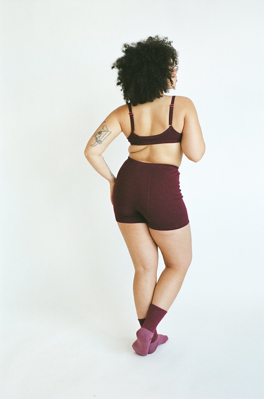Rear portrait of a model in Wine-color Pansy Stretch Short underwear.