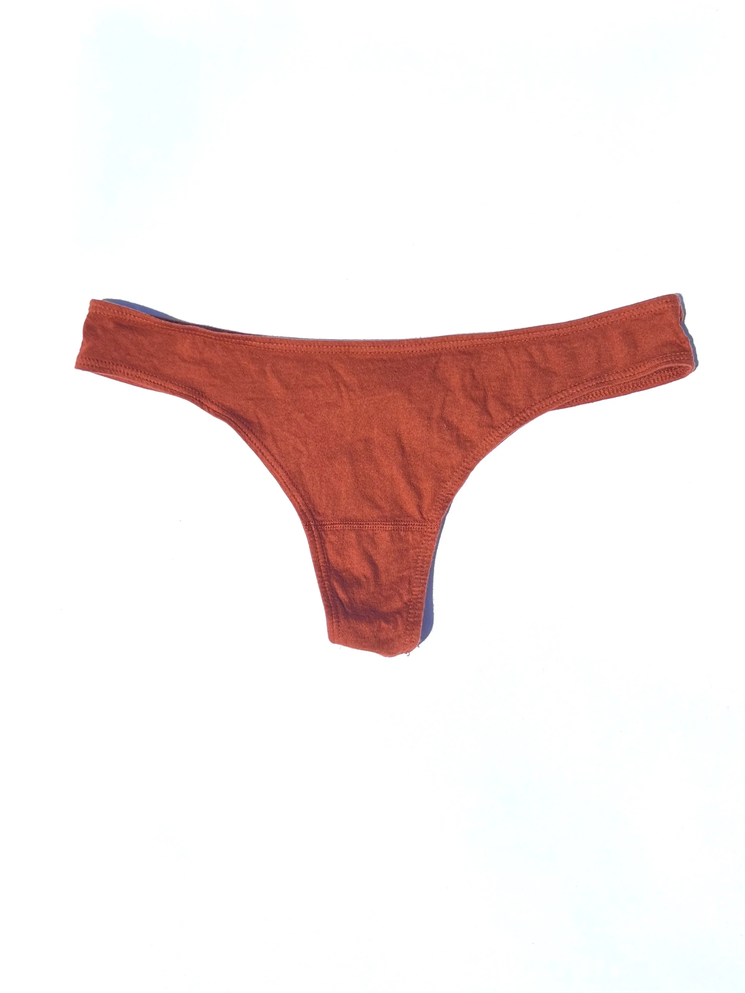 Front flat view of the Pansy organic cotton thong in Rust