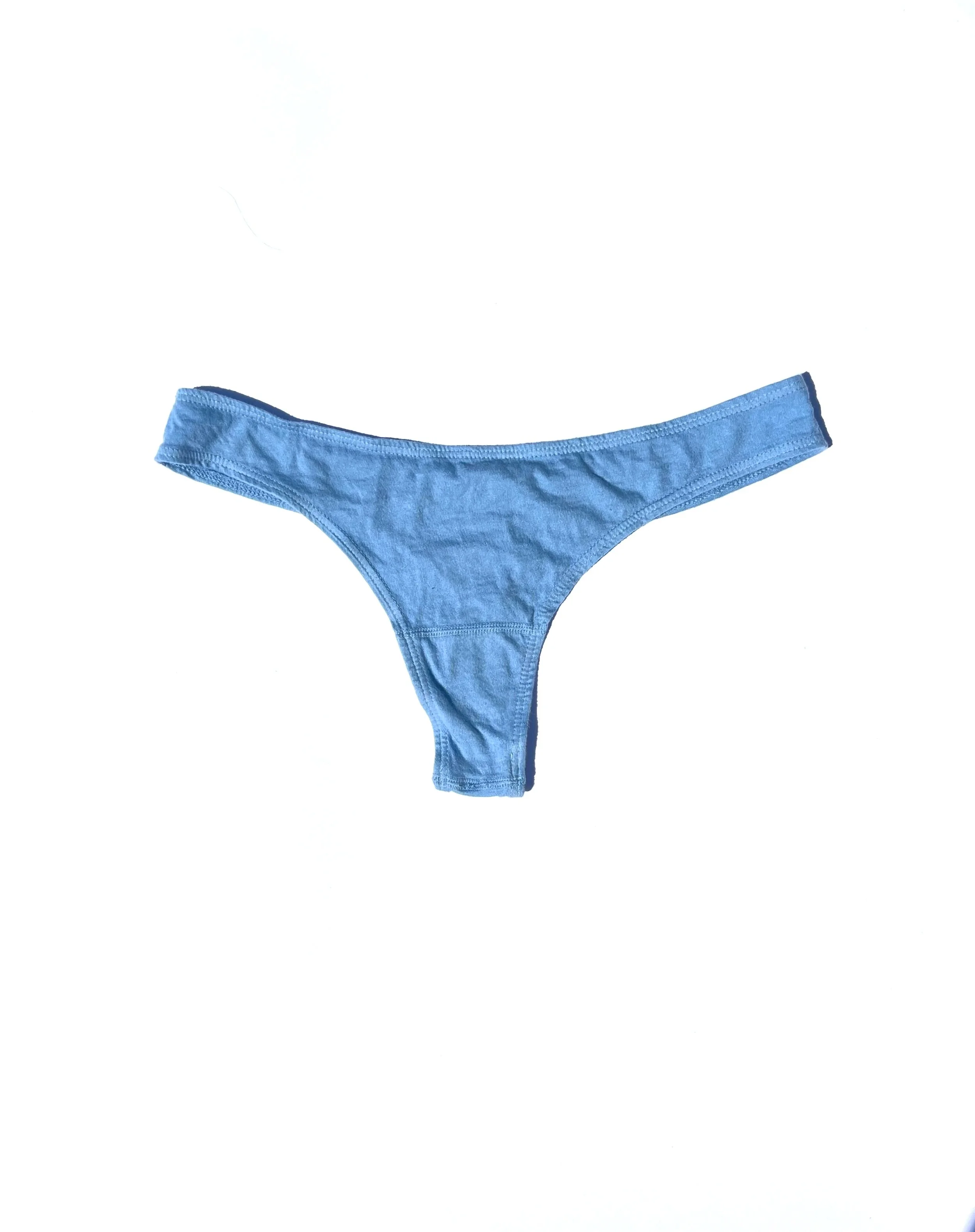 Front flat view of the Pansy organic cotton thong in Sky