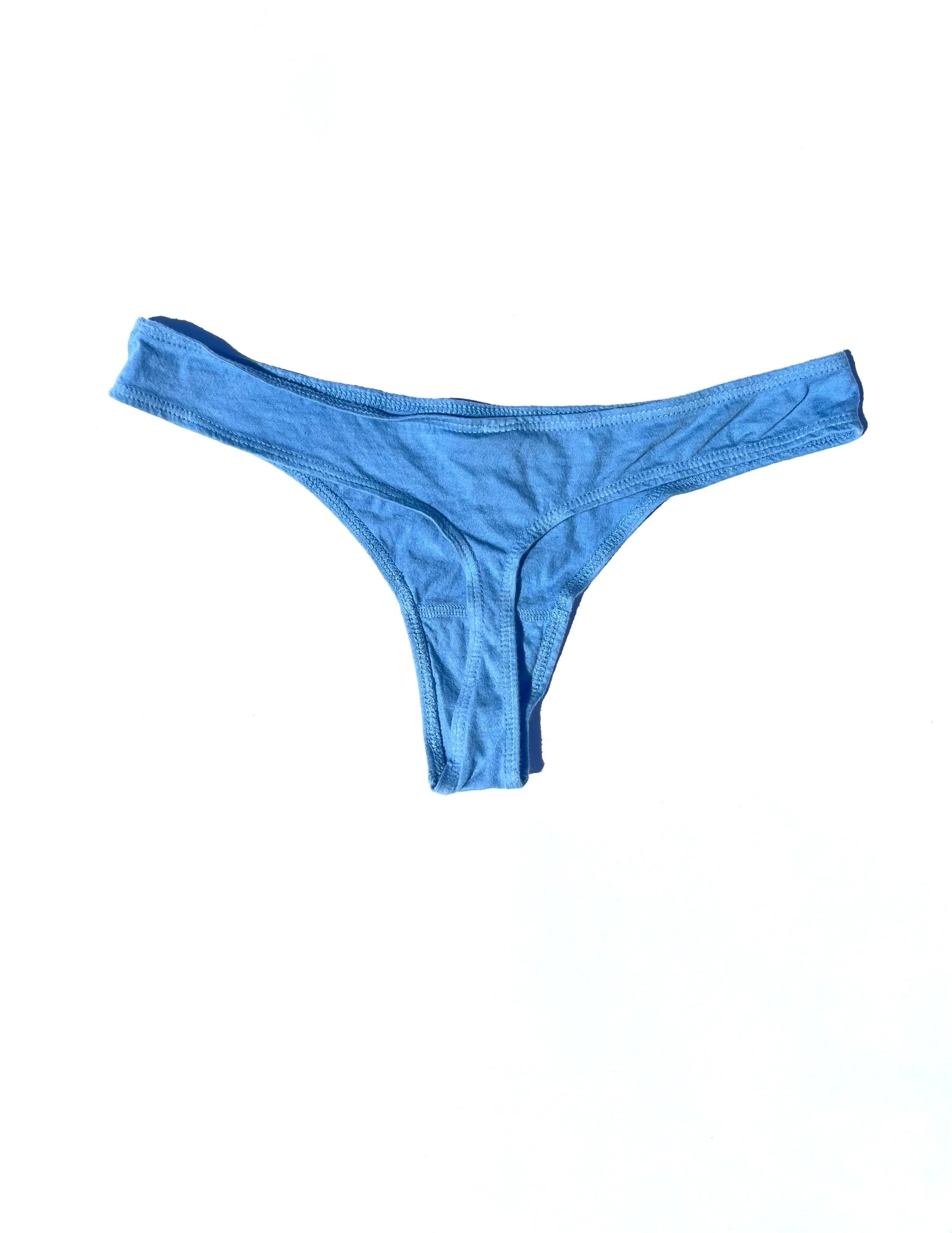 Rear flat view of the Pansy organic cotton thong in Sky