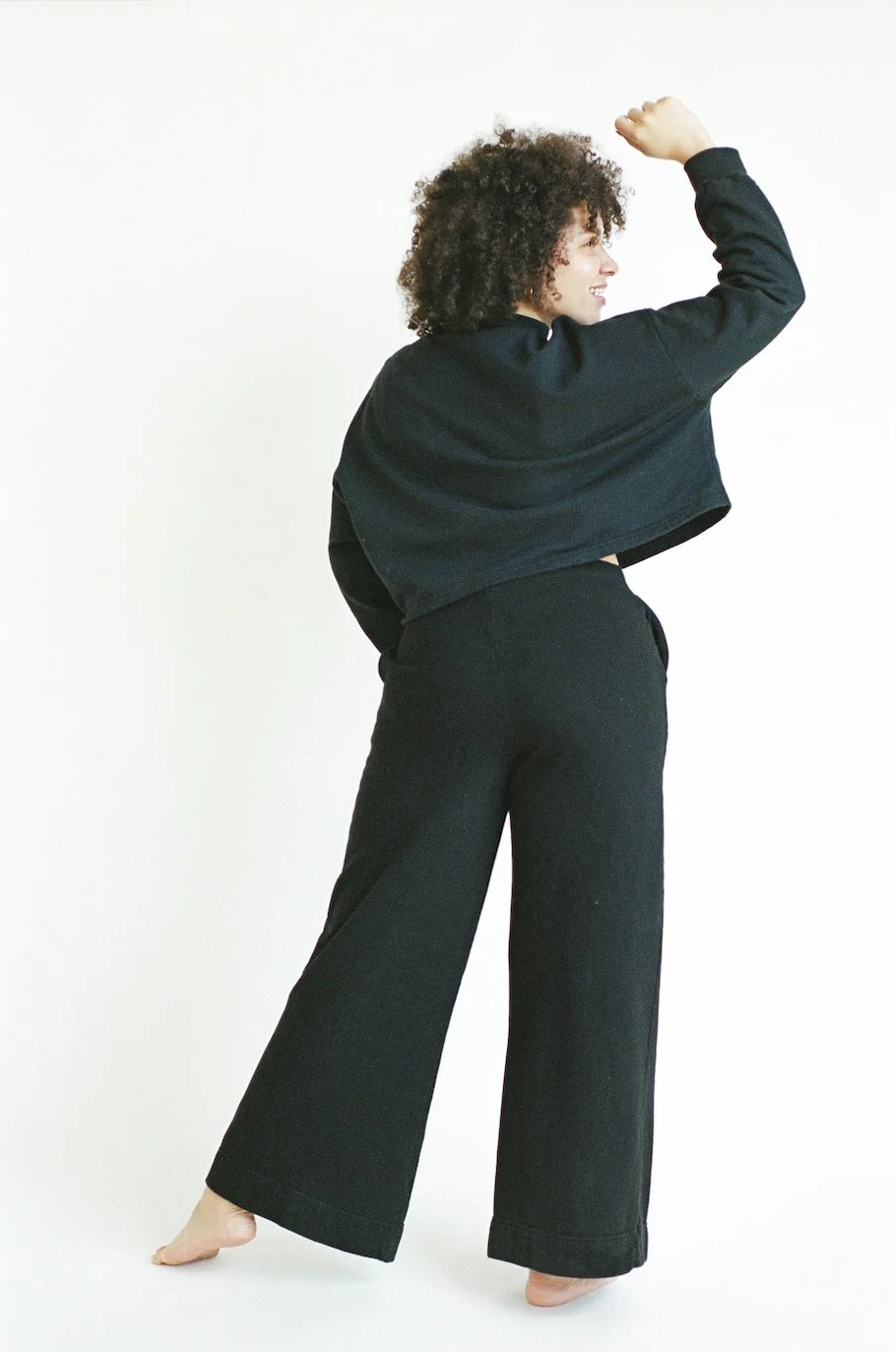 Back view of Pansy organic cotton Fleece Pants in black.