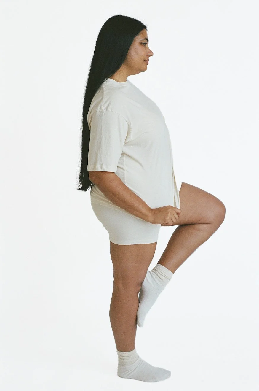 Side view of Pansy organic cotton t-shirt in undyed natural cotton color.
